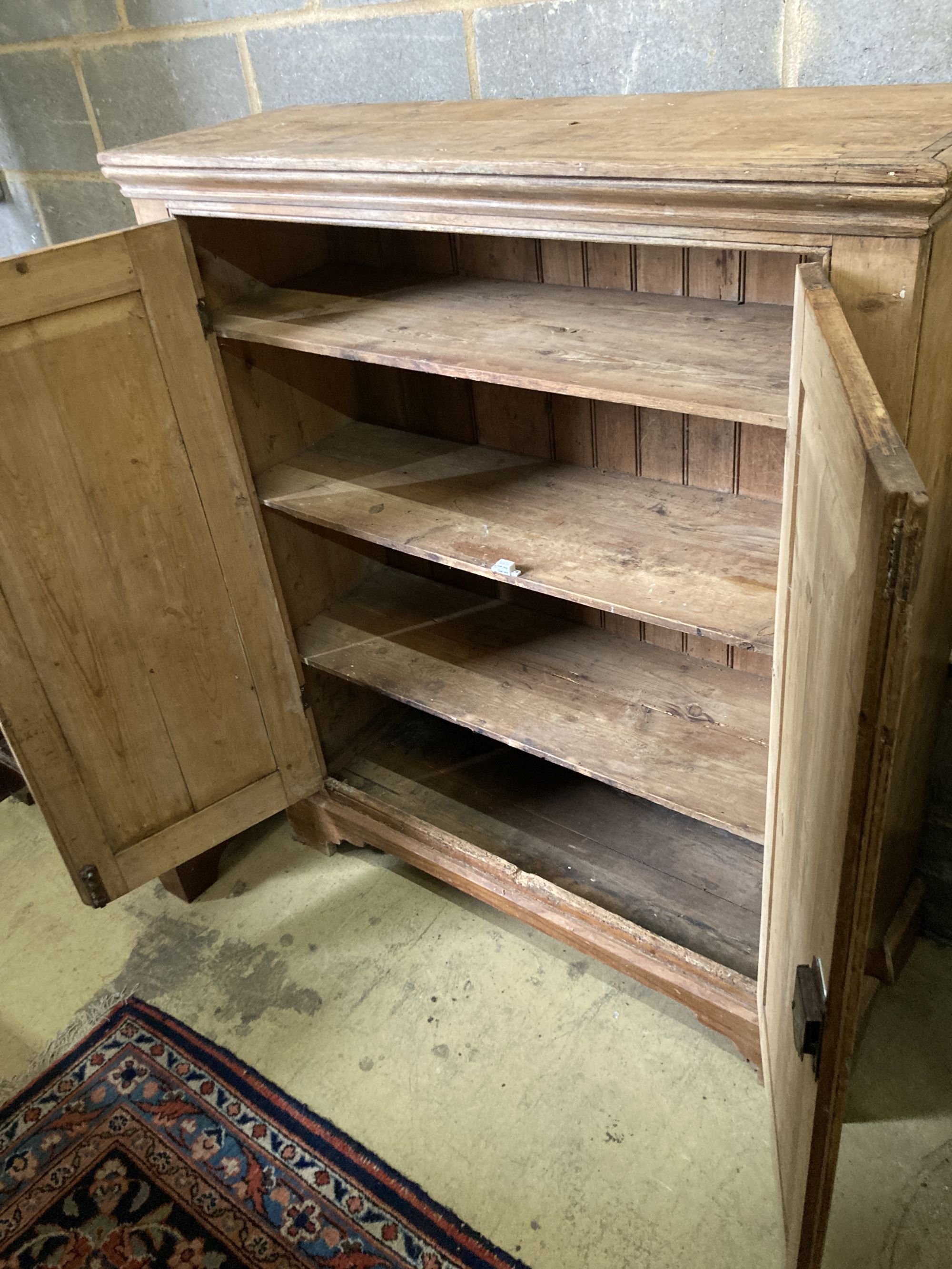 A Victorian pine two door cabinet, width 109cm, depth 37cm, height 127cm